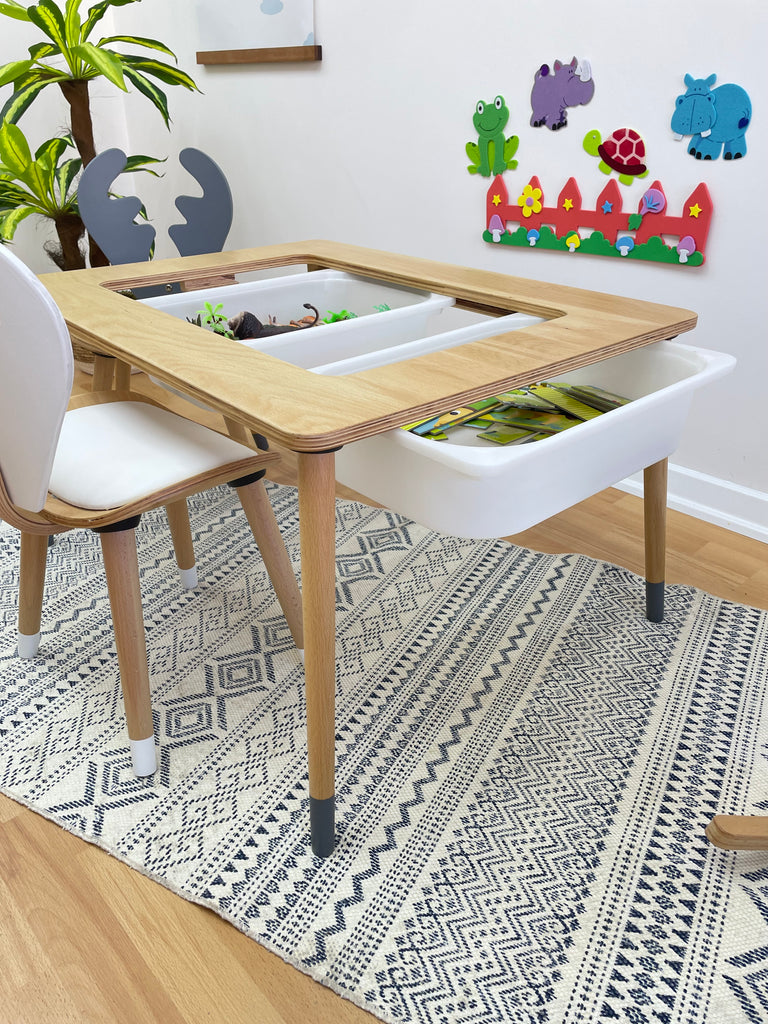 a child's playroom with toys and a rug