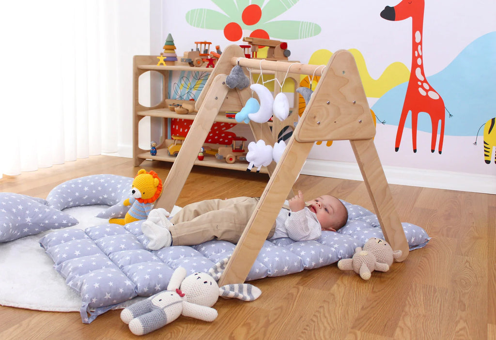 a baby laying on a bed in a room