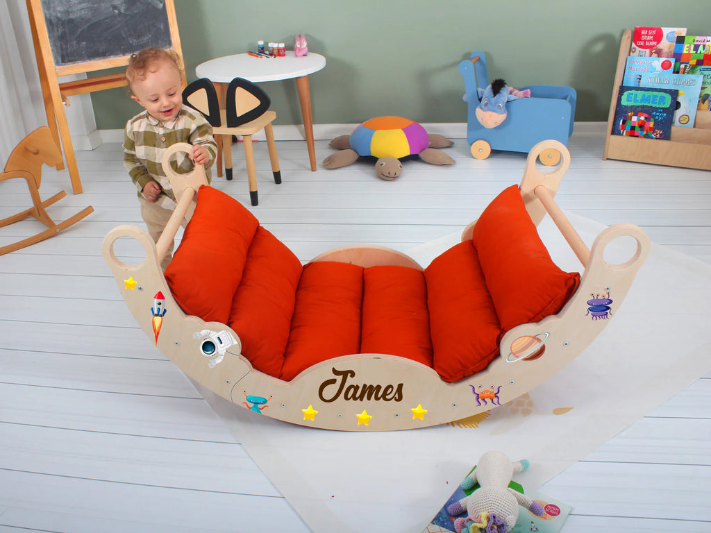 a toddler playing with a wooden toy sleigh