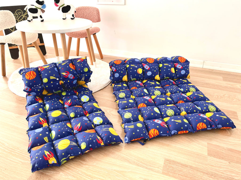 a child's sleeping bag and a child's sleeping bag on the floor