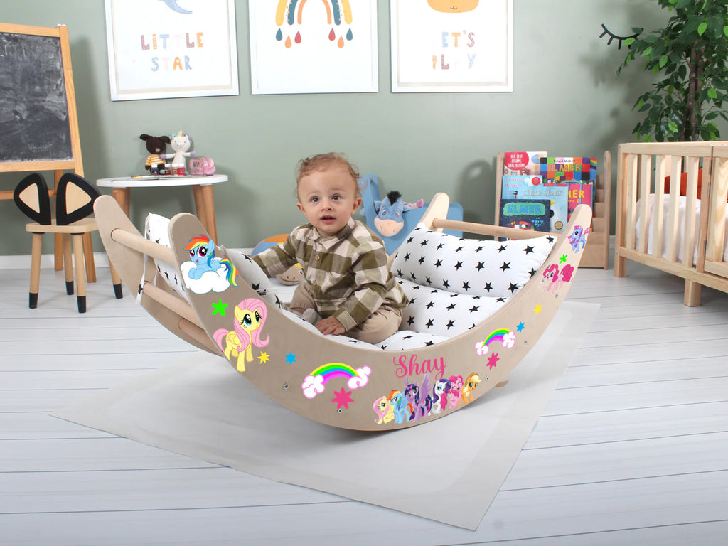 a baby sitting in a wooden rocking chair