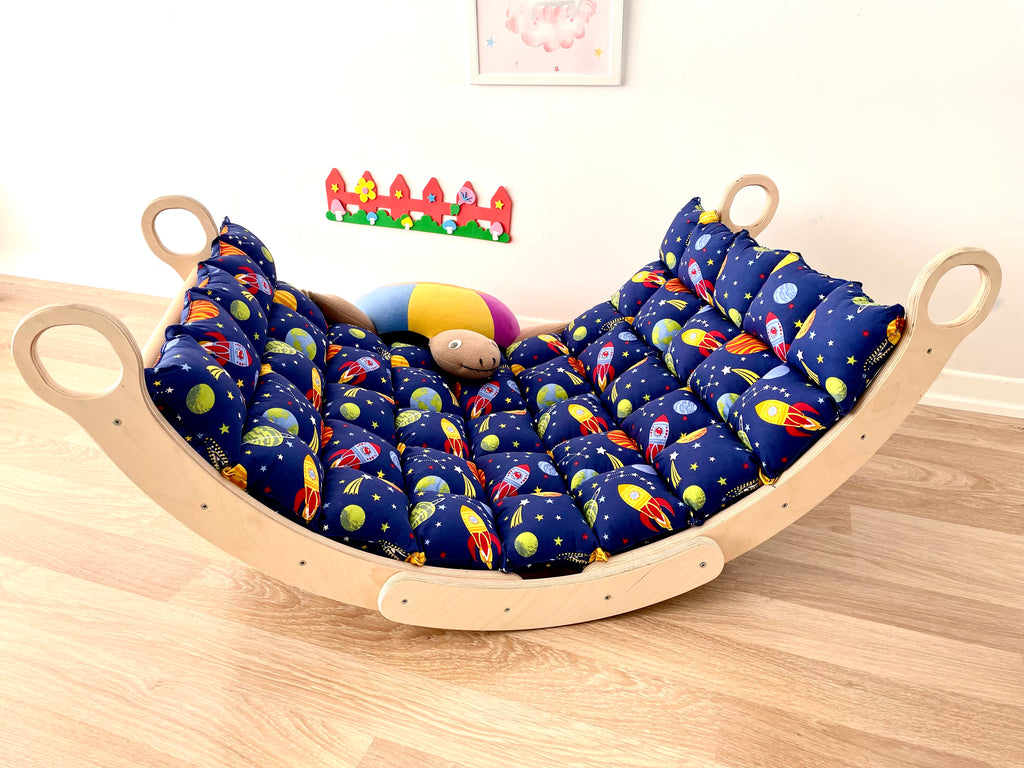 a child's bed with a stuffed animal in it