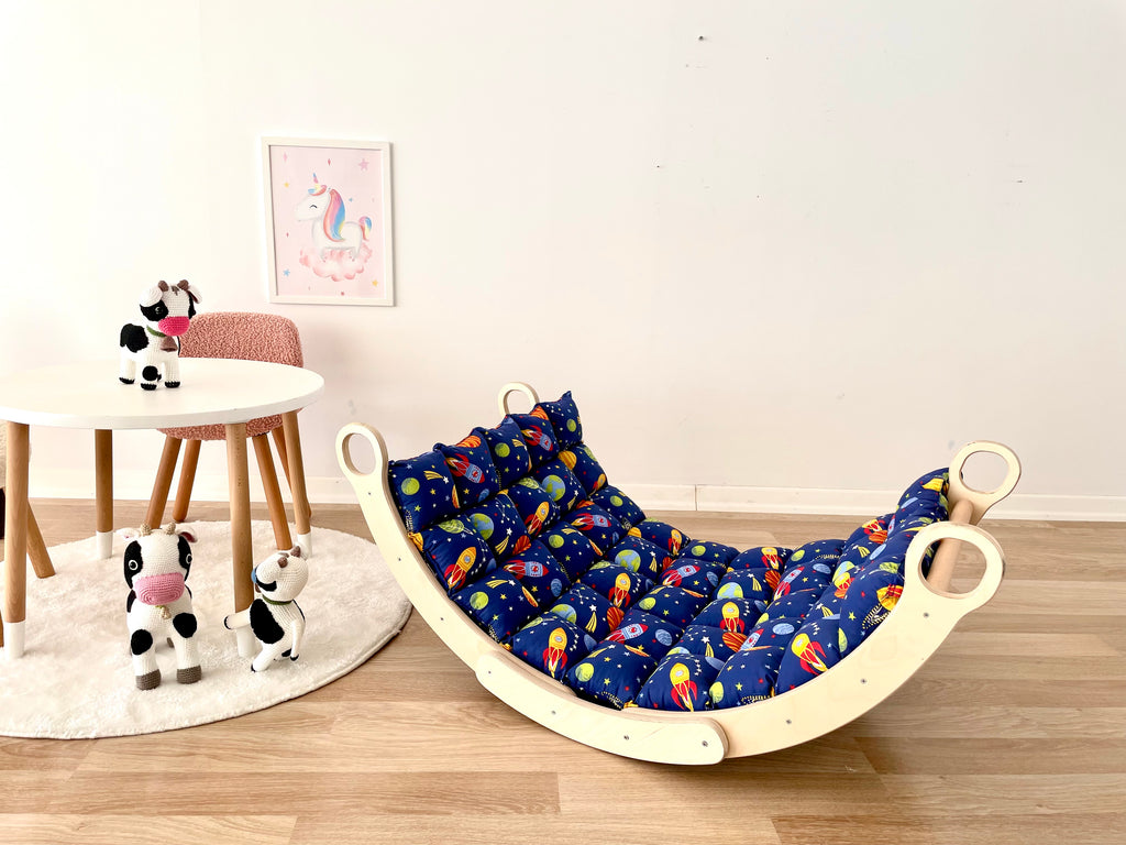 a kid's room with a rocking chair and toys